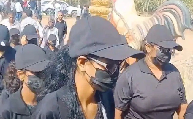 Lady Bouncers With Masks At 'Kodi Pandelu'