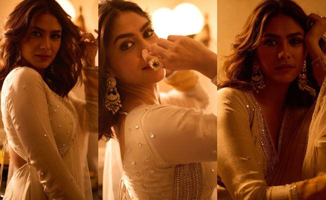 Mrunal showcases her golden look in dim lighting